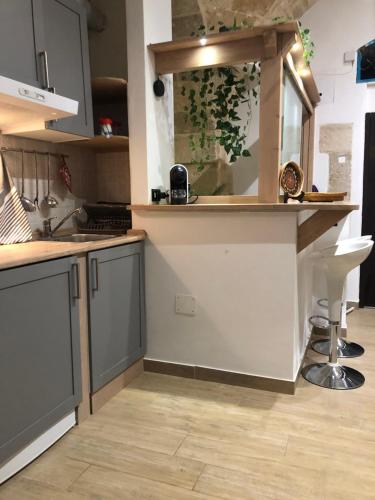a kitchen with a sink and a counter top at Casa Sipontina in Barletta