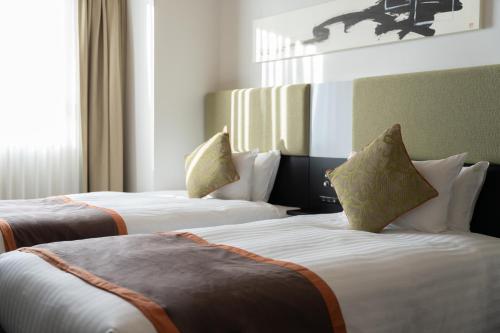 Katil atau katil-katil dalam bilik di Hotel Vista Hiroshima