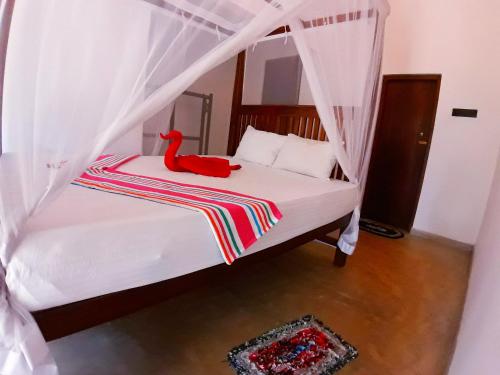 Postelja oz. postelje v sobi nastanitve Cashew Villa Hiriketiya