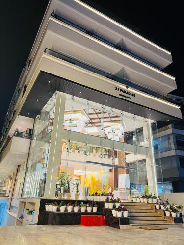 a store front of a building with stairs and plants at SJ PARADISE in Dehradun