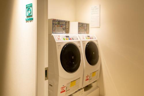 a washer and dryer on display in a room at Prince Smart Inn Naha in Naha