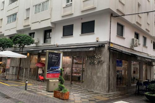 a store on a street in front of a building at Apartamento Central D in Algeciras