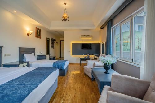 Postel nebo postele na pokoji v ubytování Ugurlu Termal Tatil Köyü