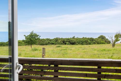 a view of a field from a window at Hotell och Restaurang Hovs Hallar in Båstad