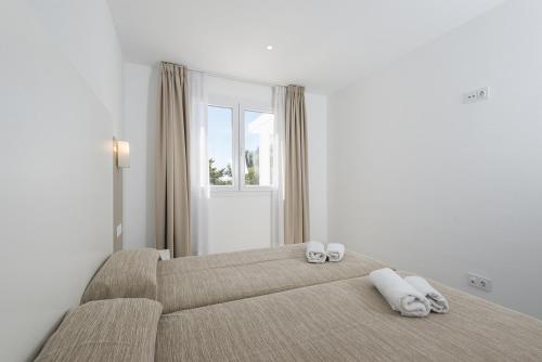 Ένα ή περισσότερα κρεβάτια σε δωμάτιο στο Villas Calan Bosch Feli