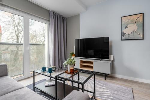 Televízia a/alebo spoločenská miestnosť v ubytovaní CityCenterApartments-11/19