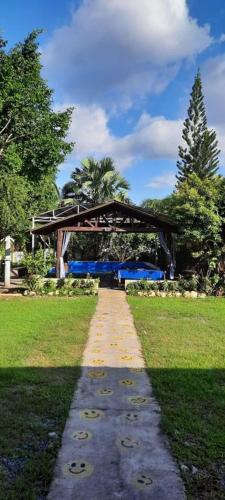 a walkway leading to a pavilion in a park at Spacious Resort in Pansol up to 20 pax in Pansol