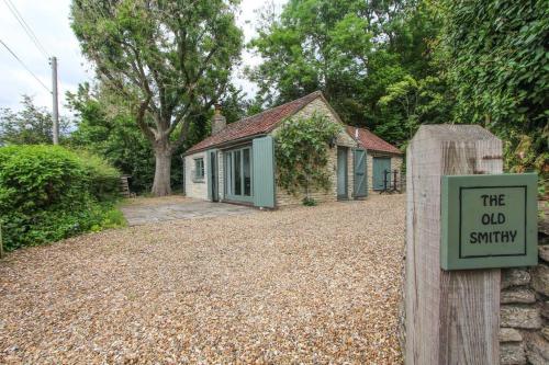 a house with a sign that reads the old survey at Perfect Getaway Close to Bath and Bristol in Bitton