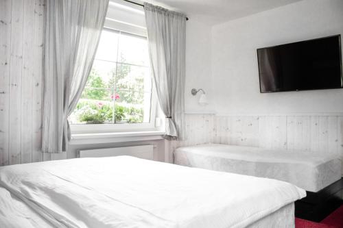 Un ou plusieurs lits dans un hébergement de l'établissement Rodinný resort UKO