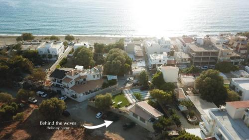 an aerial view of a city next to the ocean at Behind The Waves in Kalamaki Heraklion
