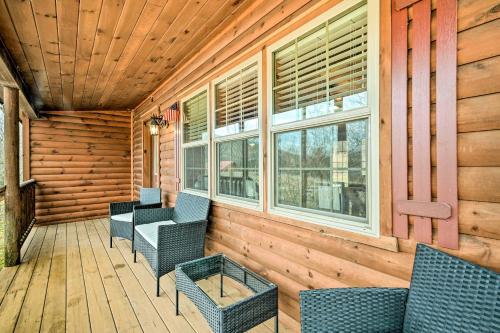 a porch with chairs and a table and windows at Cozy Cabin in Parsons Hike, Fish and Explore! in Parsons