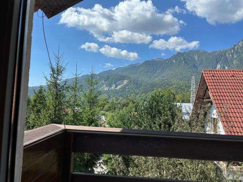 a view of a mountain from a balcony at Rustic House Busteni in Buşteni