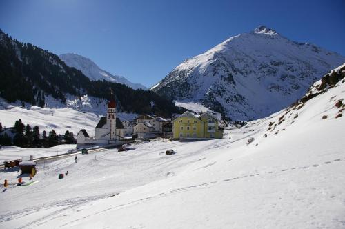 a small town in the snow with a mountain at Appartement Wildspitz' in Vent