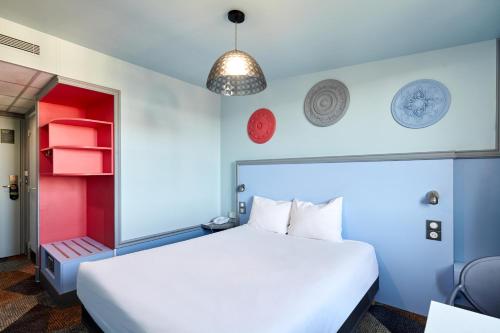 Un ou plusieurs lits dans un hébergement de l'établissement B&B HOTEL Saint-Maur Créteil