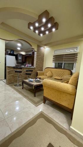 a living room with a couch and a table at Leen Guest House in Wadi Musa