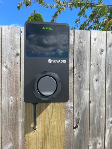 a speaker attached to a wooden fence at Courtyard Bothy in Grantown on Spey