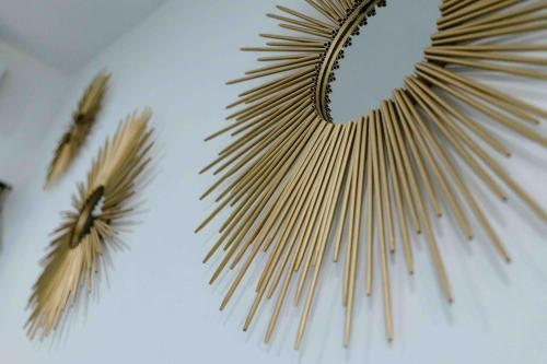 a bunch of wooden needles hanging on a wall at Hotel Naomi City center in Bacalar