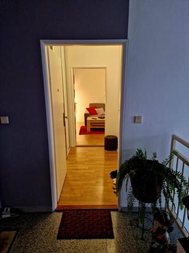 a hallway leading to a bedroom with a bed at Slnečný byt v blízkosti historického centra Free Parking in Trenčín