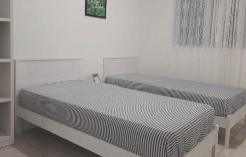 Katil atau katil-katil dalam bilik di Khayla’s Residence