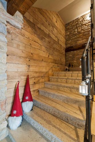 two santa hats sitting on the steps of a sauna at Malga Laben in Velo Veronese