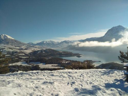 a view from the top of a mountain in the snow at Villa L'Epicléa, Chorges, entre lac et montagnes in Chorges