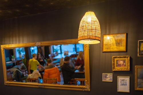 a mirror in a restaurant with people in a restaurant at Hotel Krokus in Pec pod Sněžkou