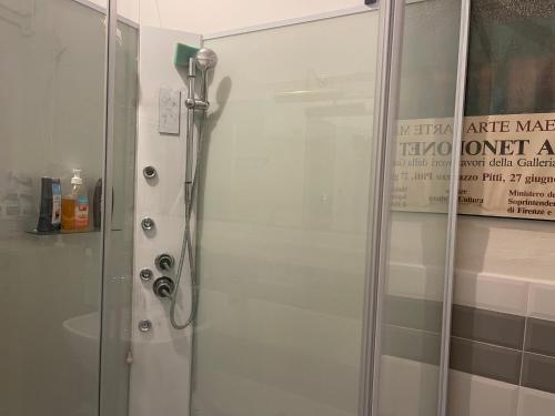 a shower with a glass door in a bathroom at Casa di Mochi in Rome