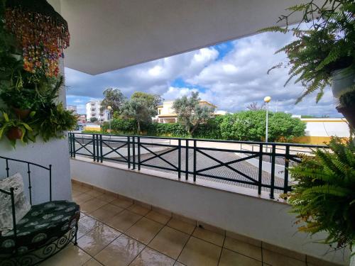 a balcony with a view of the street at T1 Falesia in Albufeira