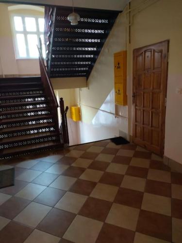 an empty room with a staircase and a door at Cozy room - 10 min.from Rynek in Wrocław