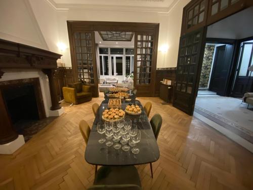 a living room with a table with wine glasses at Maison Mimerel Colodge in Roubaix