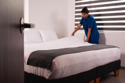 Postel nebo postele na pokoji v ubytování Hotel Montefiore