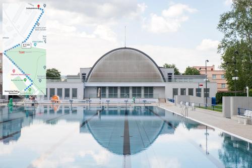 een zwembad voor een gebouw bij CENTRAL PARK ATTIC APARTMENT in Košice