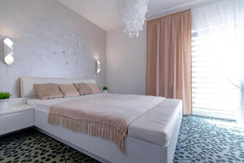 Posteľ alebo postele v izbe v ubytovaní Apartament & Spa 5 Mórz