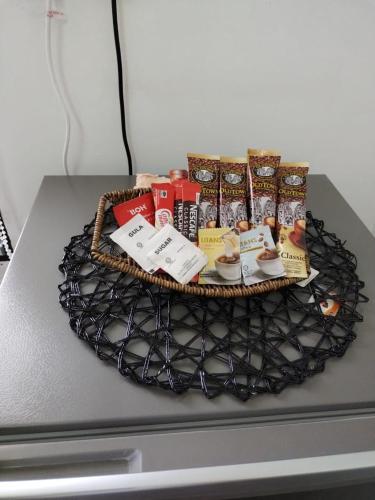 a basket of food on top of a table at Homestay Embah Ros & Embah Lek in Hutan Melintang