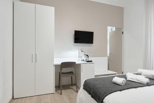 Letto o letti in una camera di Casa Flaminia