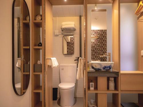 a bathroom with a toilet and a sink at Belive&More in Macau