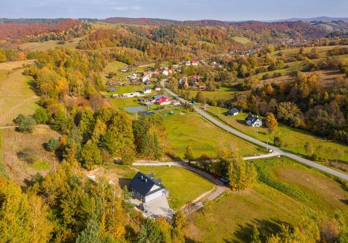 an aerial view of a small village in the forest at Antkowe Wzgórze in Polańczyk