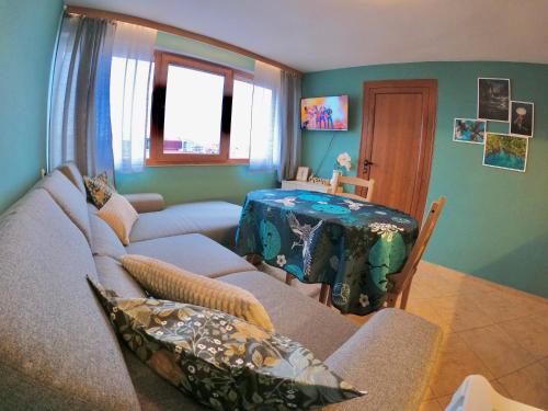 a living room with a couch and a table at Sunset Yavorov Pomorie in Pomorie