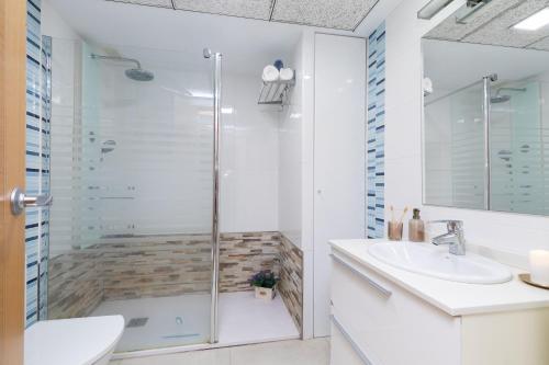 a bathroom with a shower and a sink at Veramar Beach Apartment in Valencia