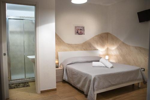 Postel nebo postele na pokoji v ubytování B&B Pastello