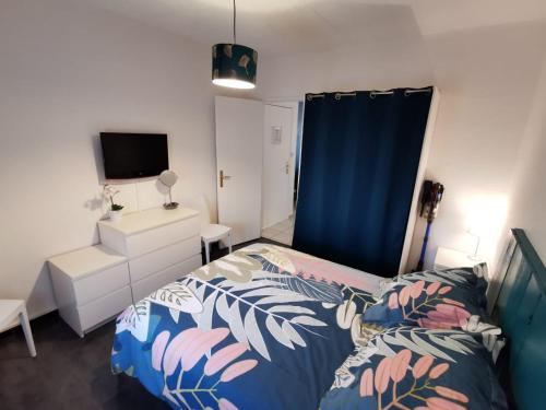 Ένα ή περισσότερα κρεβάτια σε δωμάτιο στο Appartement Le Mistral