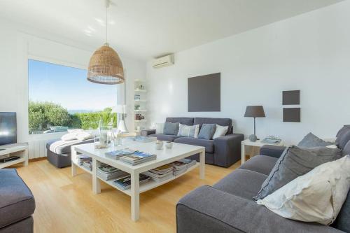 a living room with a couch and a table at V022 - VILLA ELS OLIVARS in Pau