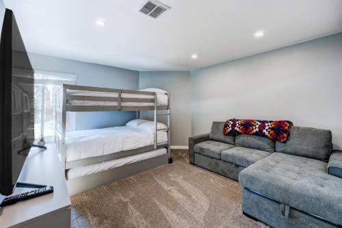a bedroom with a bunk bed and a couch at Incline Village Getaway in Incline Village