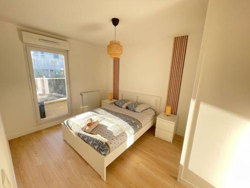 Posteľ alebo postele v izbe v ubytovaní Bel appartement pour 6 avec parking - Rive gauche - 183
