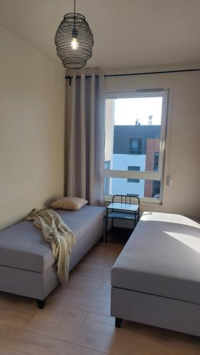 Posteľ alebo postele v izbe v ubytovaní Apartament SEVEN z miejscem parkingowym
