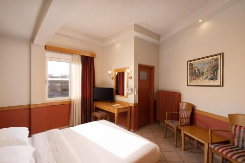 Ένα ή περισσότερα κρεβάτια σε δωμάτιο στο Hotel Ntina