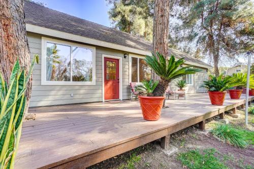 a home with a wooden porch with potted plants at Fallbrook Vacation Rental 3 Mi to Wineries! in Fallbrook