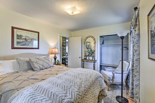 een slaapkamer met een bed, een stoel en een raam bij Lexington Vacation Home about 6 Mi to Horse Park! in Lexington