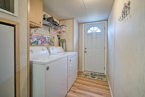 a laundry room with a washer and dryer at Peaceful Supply House about 2 Mi to Holden Beach! in Supply