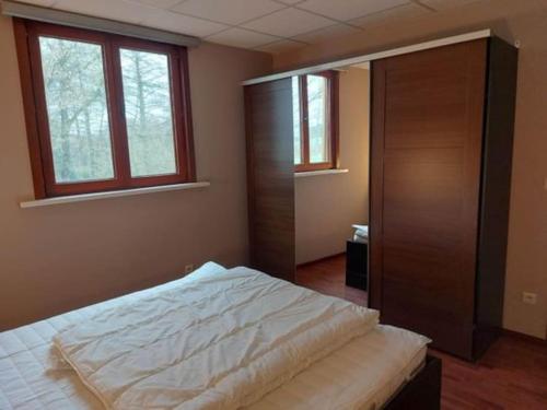 Postel nebo postele na pokoji v ubytování La Clé des Ardennes
